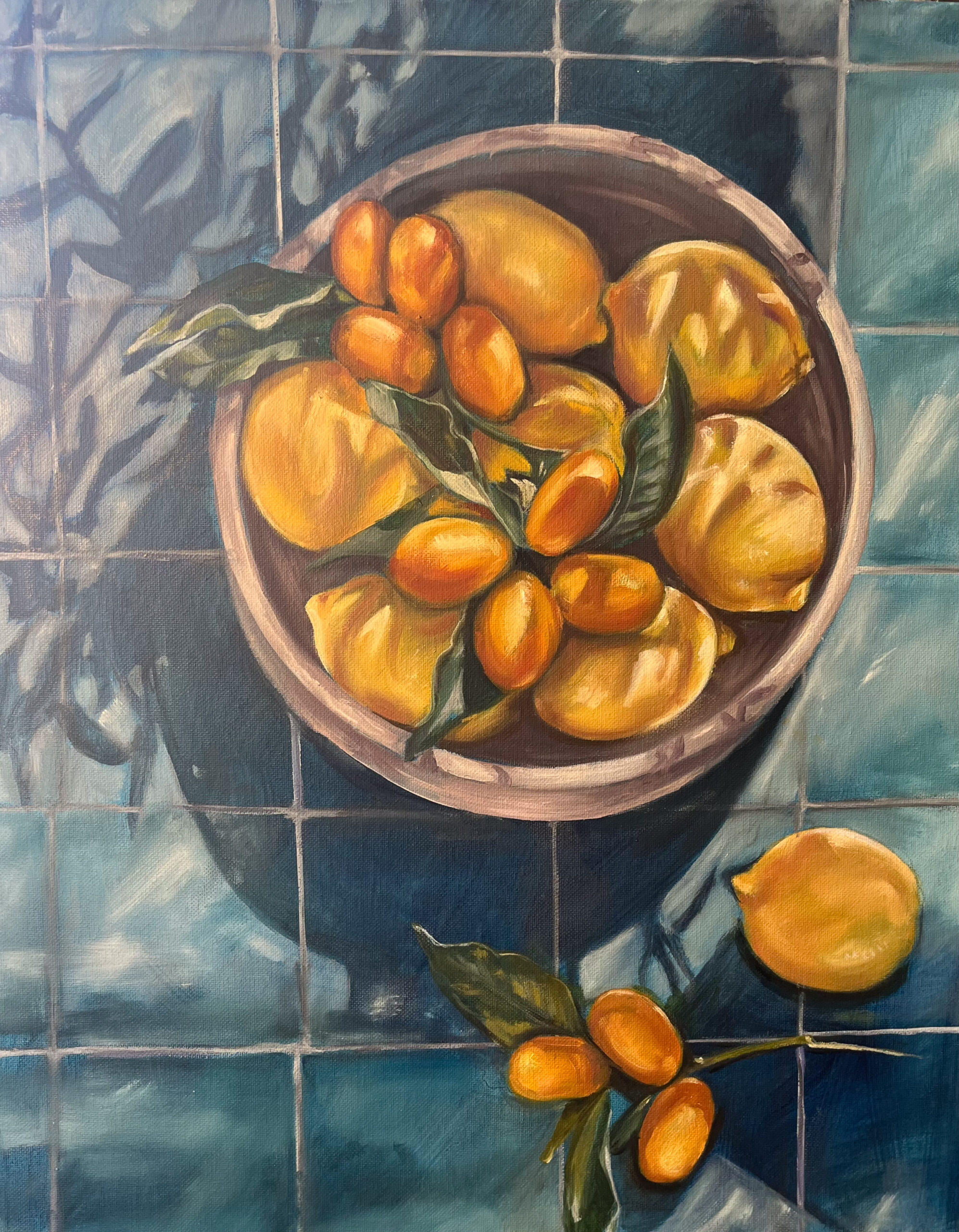 Painting of a bowl of lemons and kumquats on a blue kitchen counter.